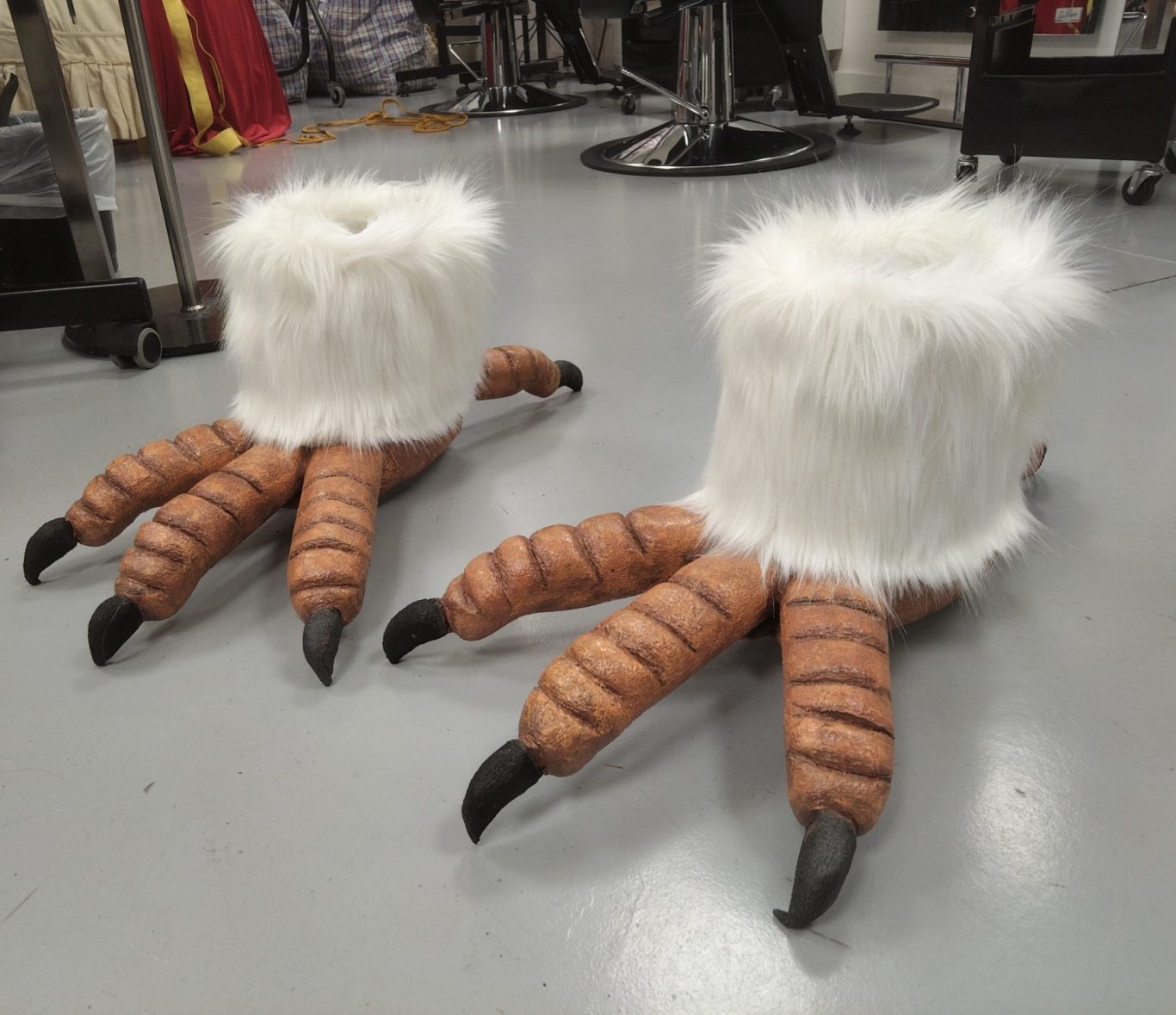 Large, brown and beige claws with fluffy white tops, resembling animal feet.