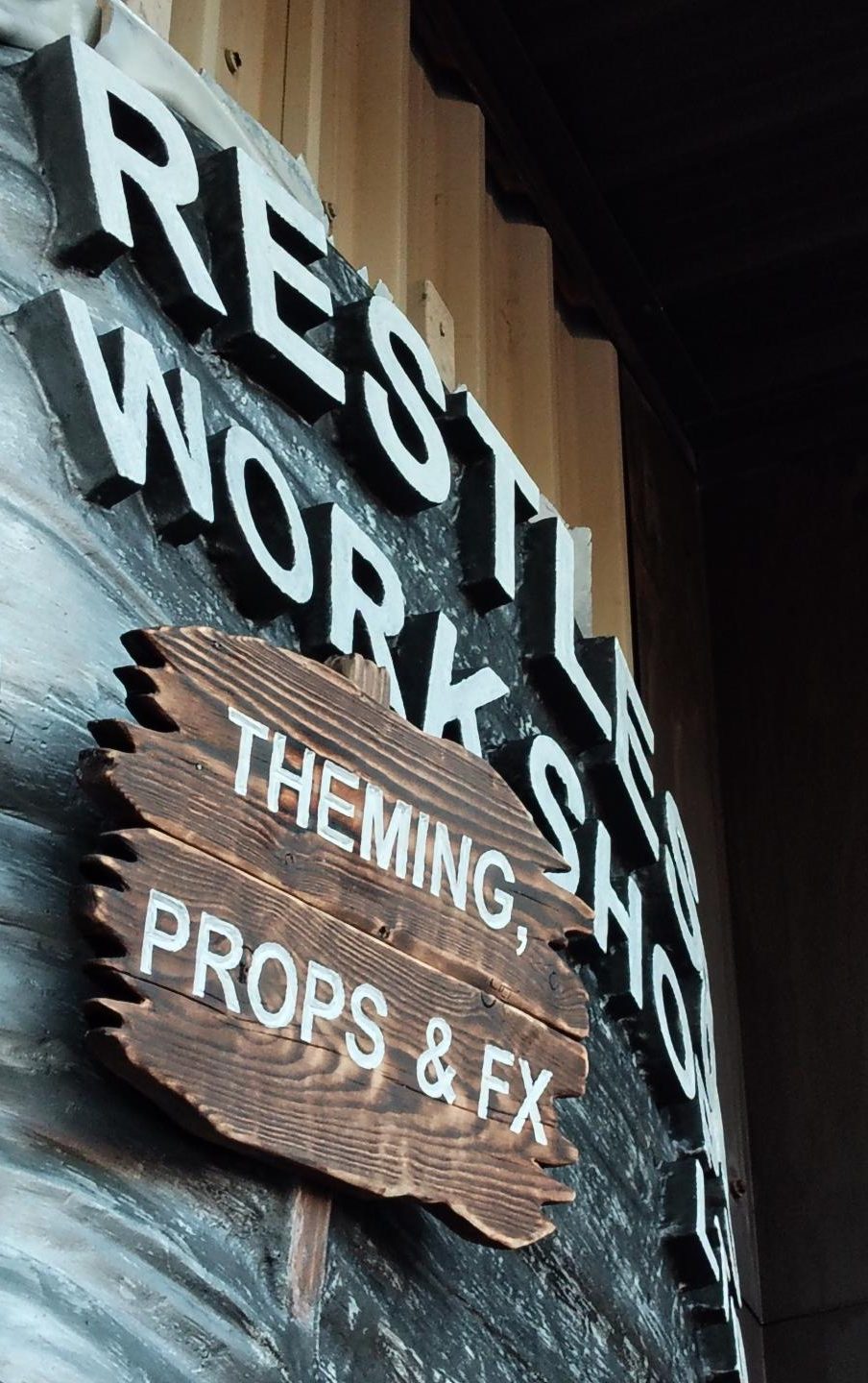 Sign for a workshop, featuring text about theming, props, and effects.